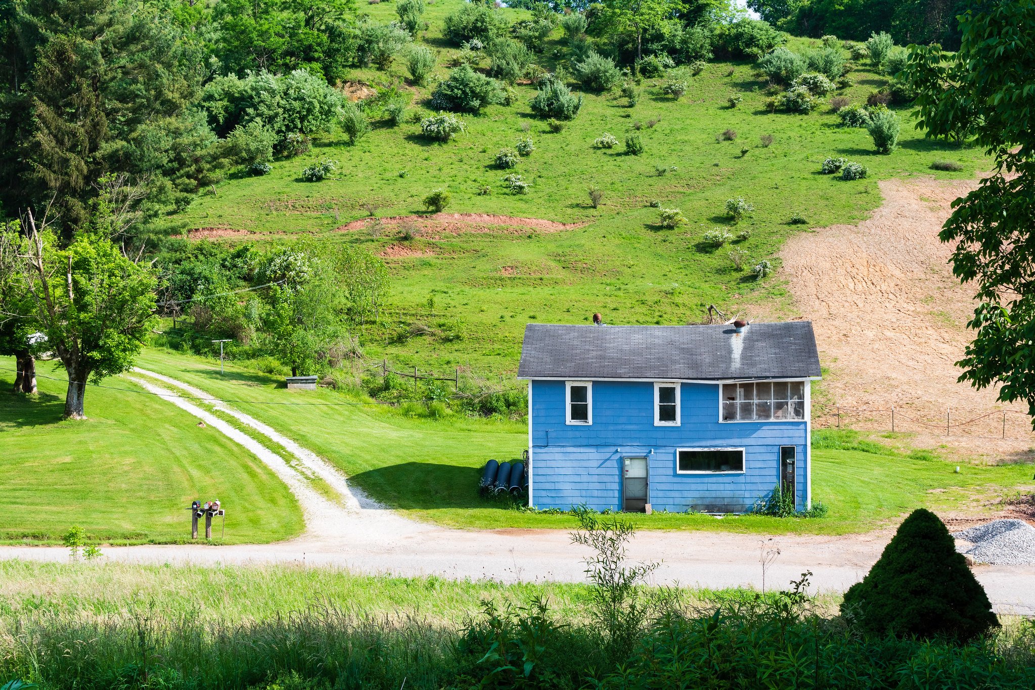 house in front of pastures to illustrate new pastures
